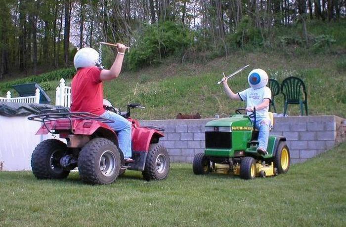 Funny pictures with captions - Rednecks jousting on lawn mowers